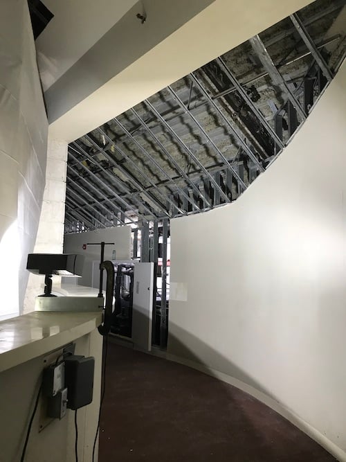 Collapsed ceiling being assessed after a water leak from above